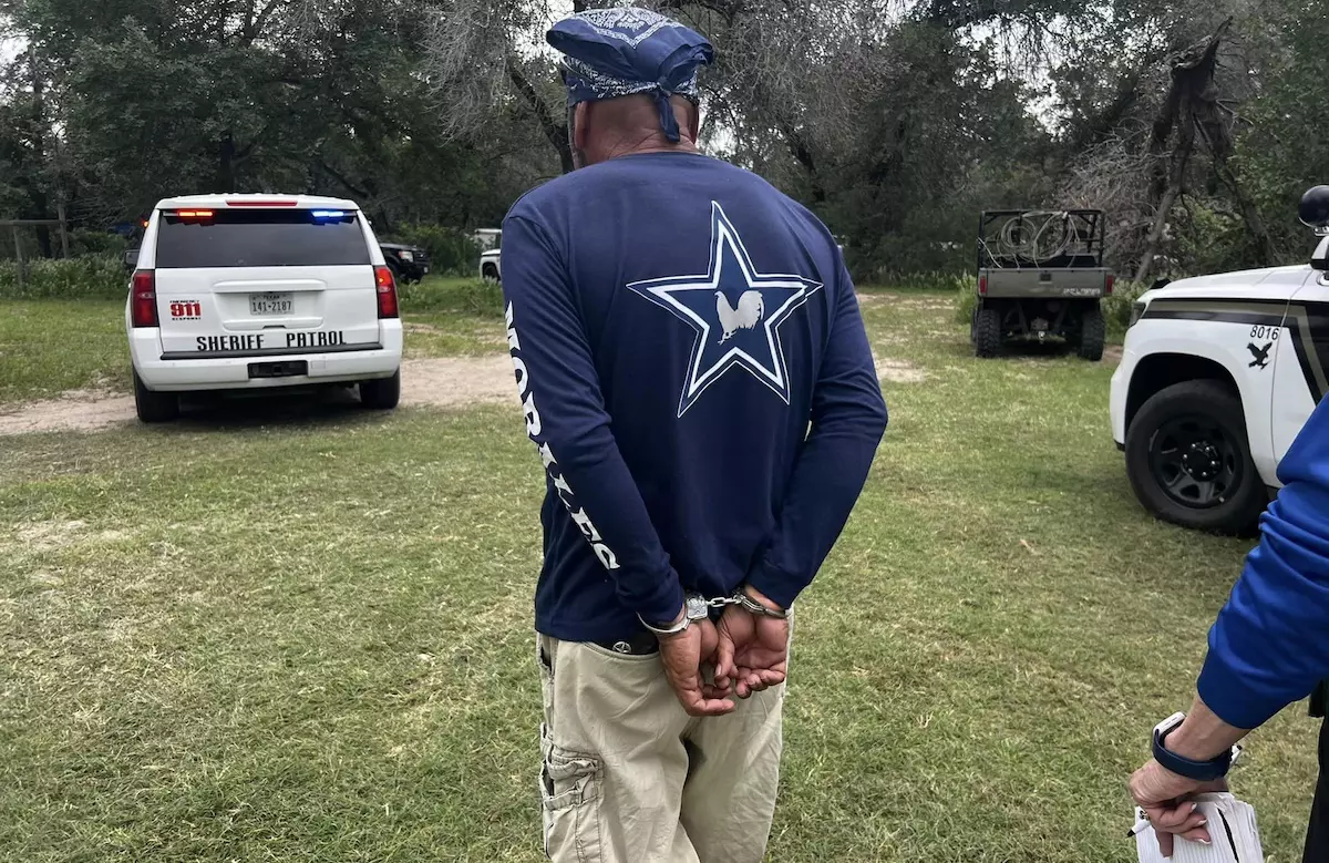 man being arrested for cockfighting-Bexar County Sheriff's Office